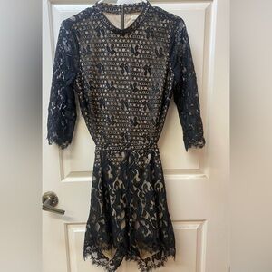 Beautiful dressy black lace romper with open back